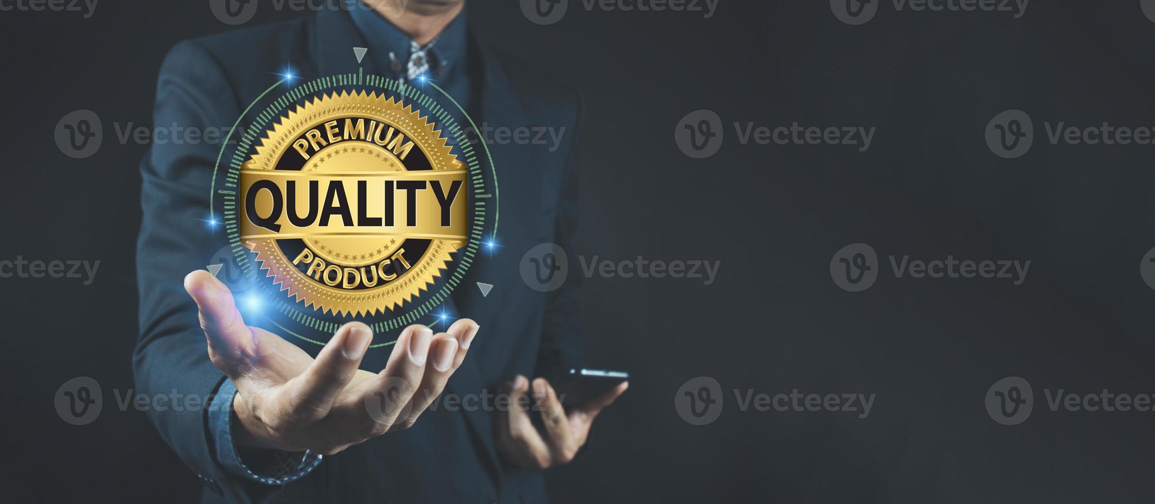 Quality product symbol in the hand of a business man.Hand shows the sign of the top service Quality assurance. photo