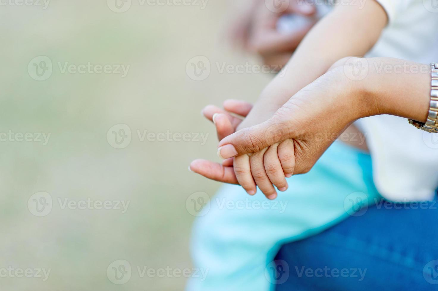 Mother's hand and baby pictures captured by mother's love Mother and child concept With copy space photo