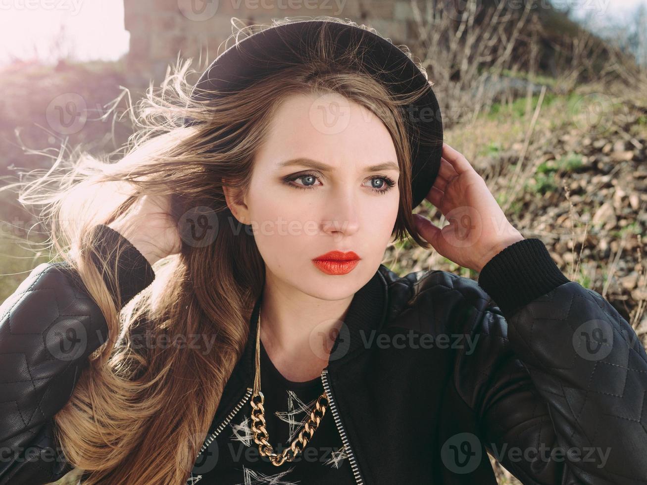 Stylish hipster woman traveler by the old bridge viaduct. Traveling, Europe, fashion, style concept photo