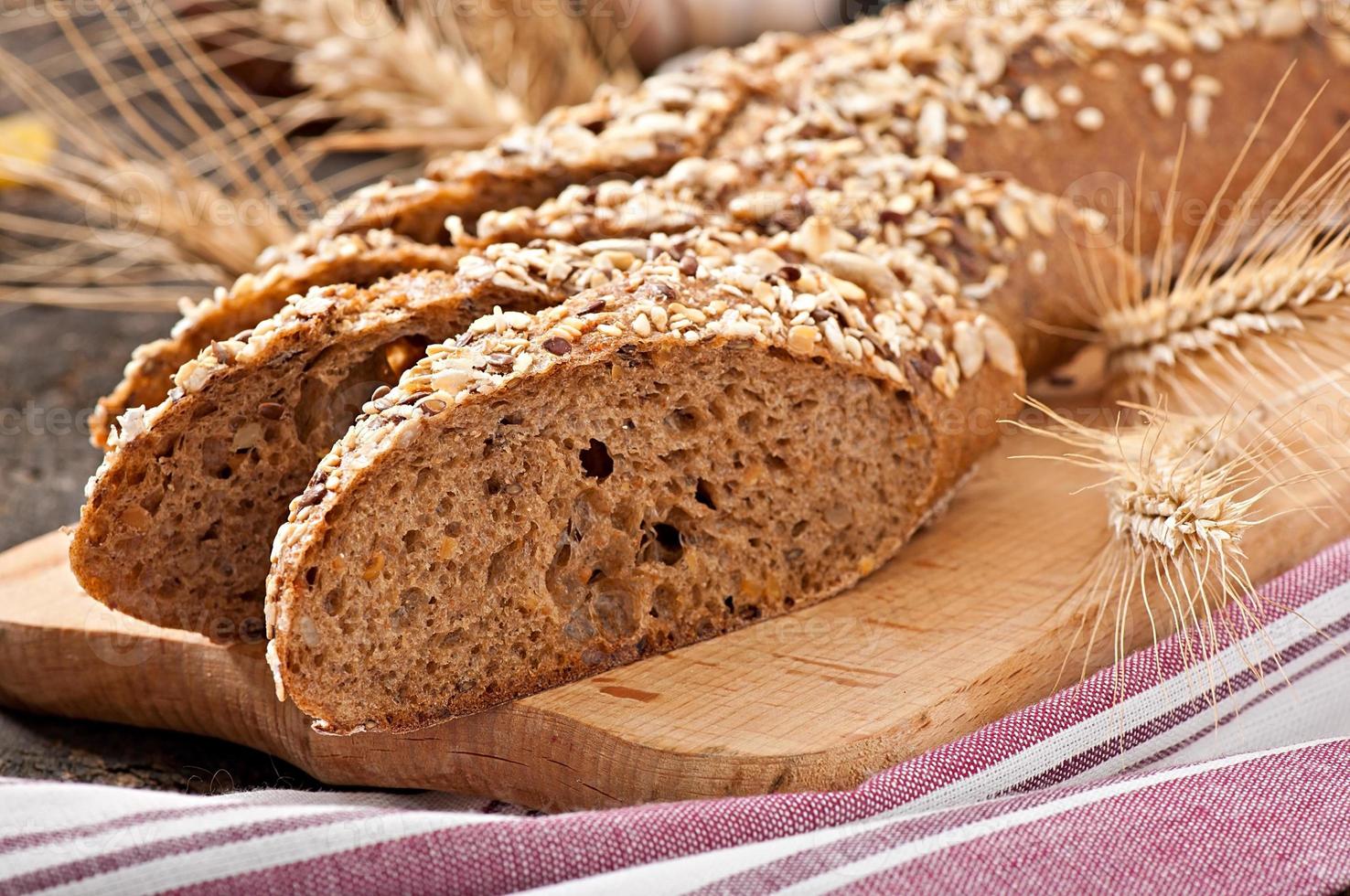 Slices of finest organic bread decorated with natural cereals photo