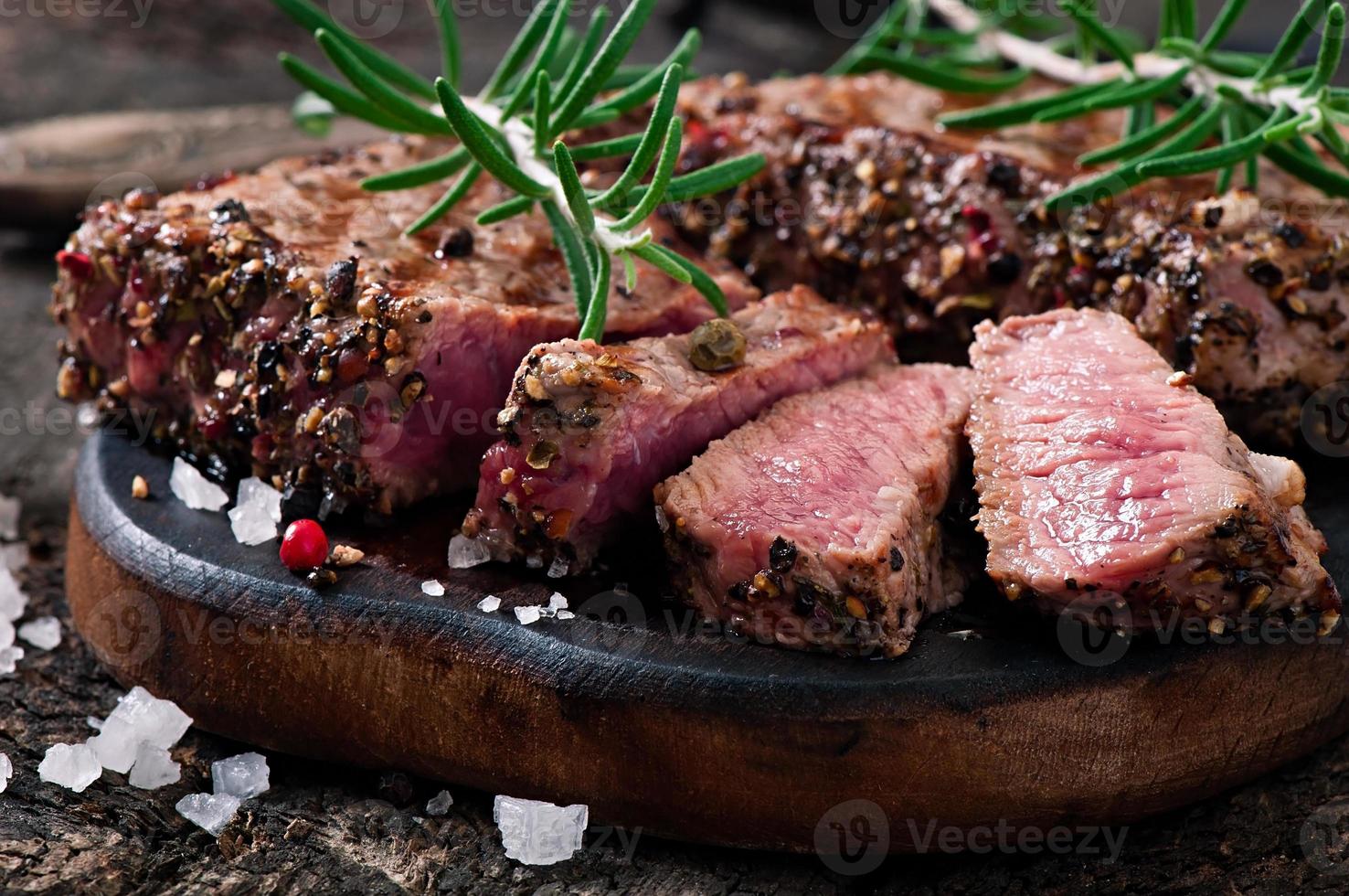 Juicy steak medium rare beef with spices photo