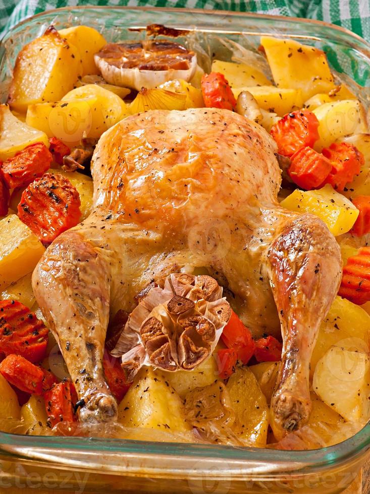 Baked chicken with potatoes photo