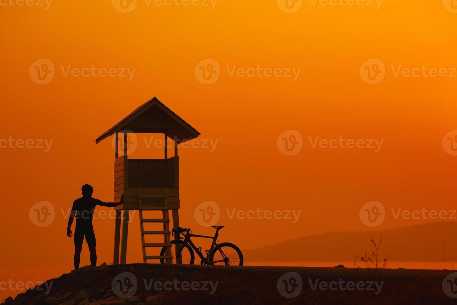 Silhouette of a cyclist on sunset in Thailand. photo