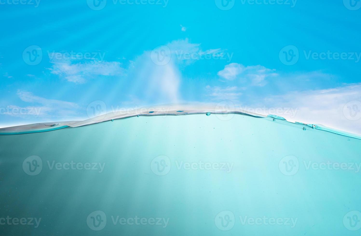 beautiful blue sea waves stopped steaming with separate bubbles on a white background. Popular corners, natural concepts photo