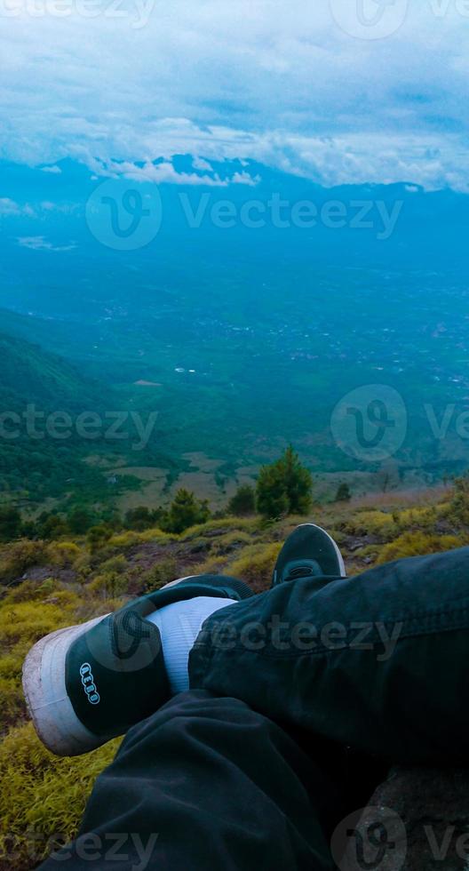 legs crossed over the mountains photo