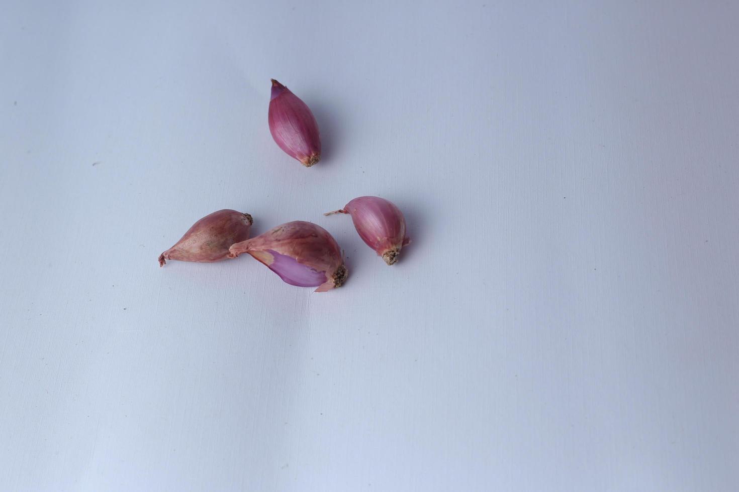 fresh red onion shallot Bawang Merah isolated on white background and healthy ,Selective Focus. photo