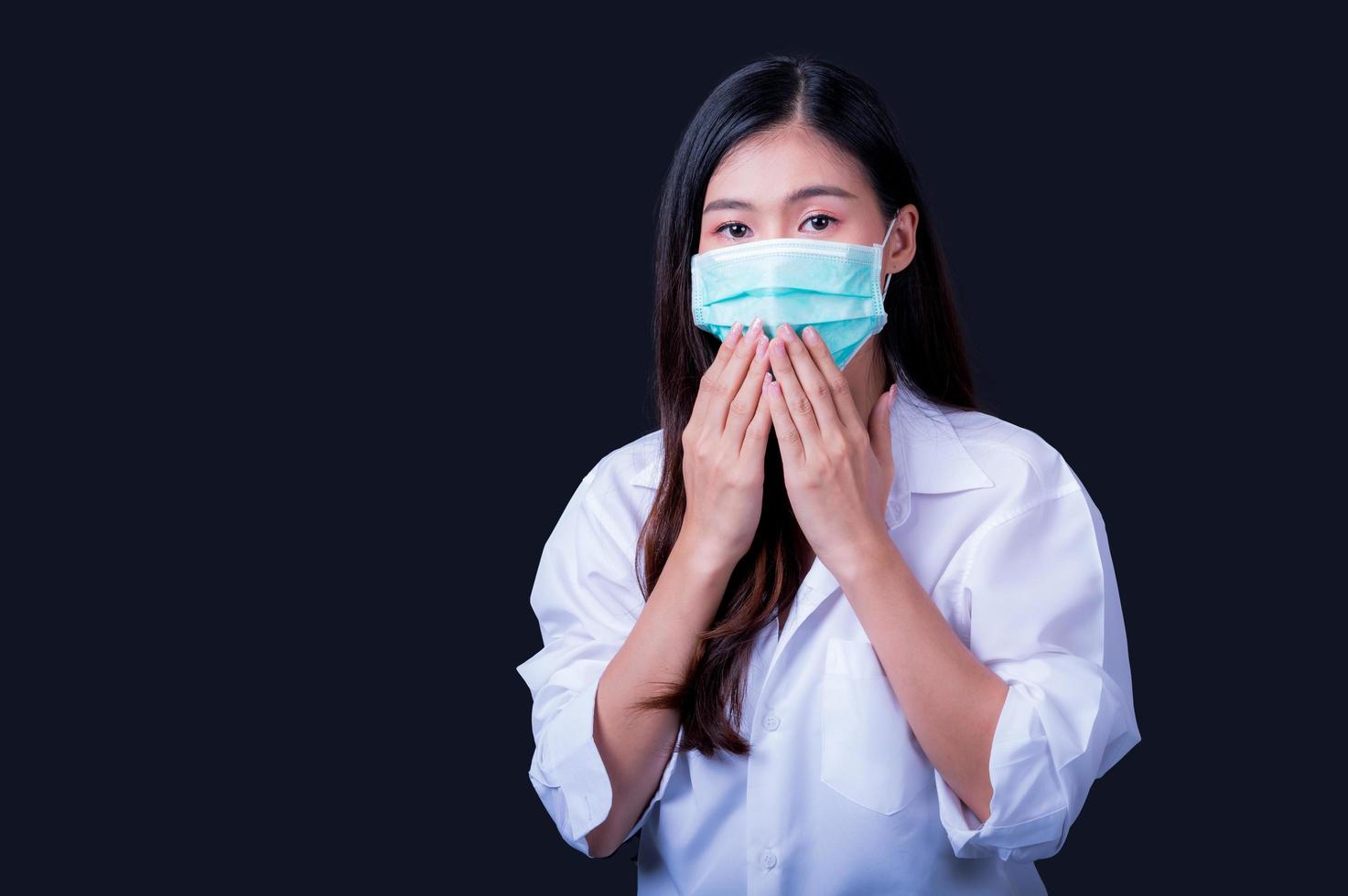 Asian women have to use a mask to cover the face to prevent pollution from dust photo