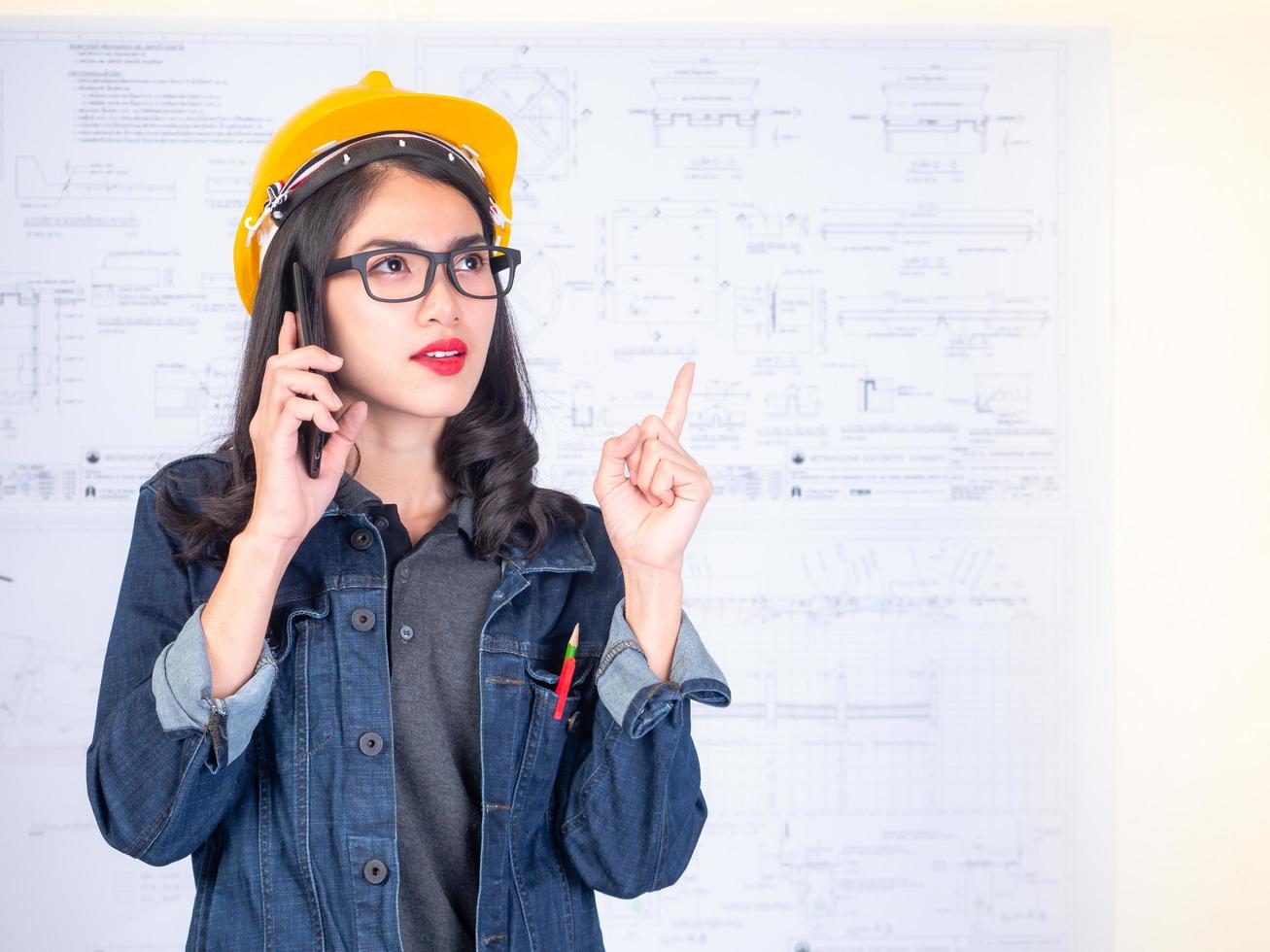 Female engineers are calling to talk about construction work photo