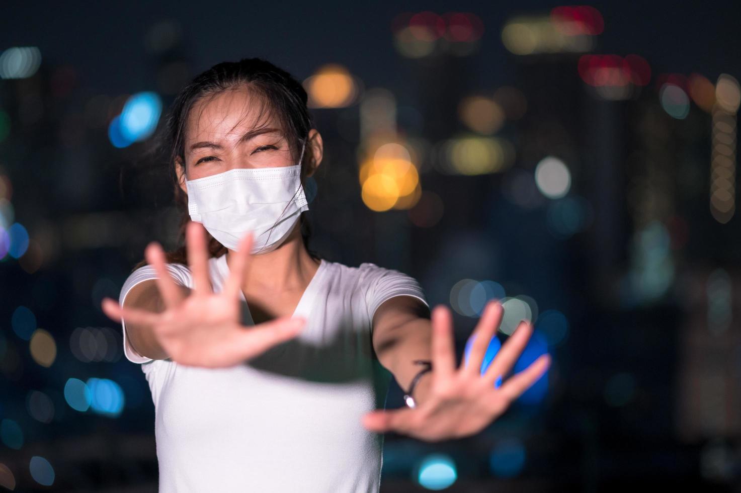 Asian women have to use a mask to cover the face to prevent pollution from dust photo