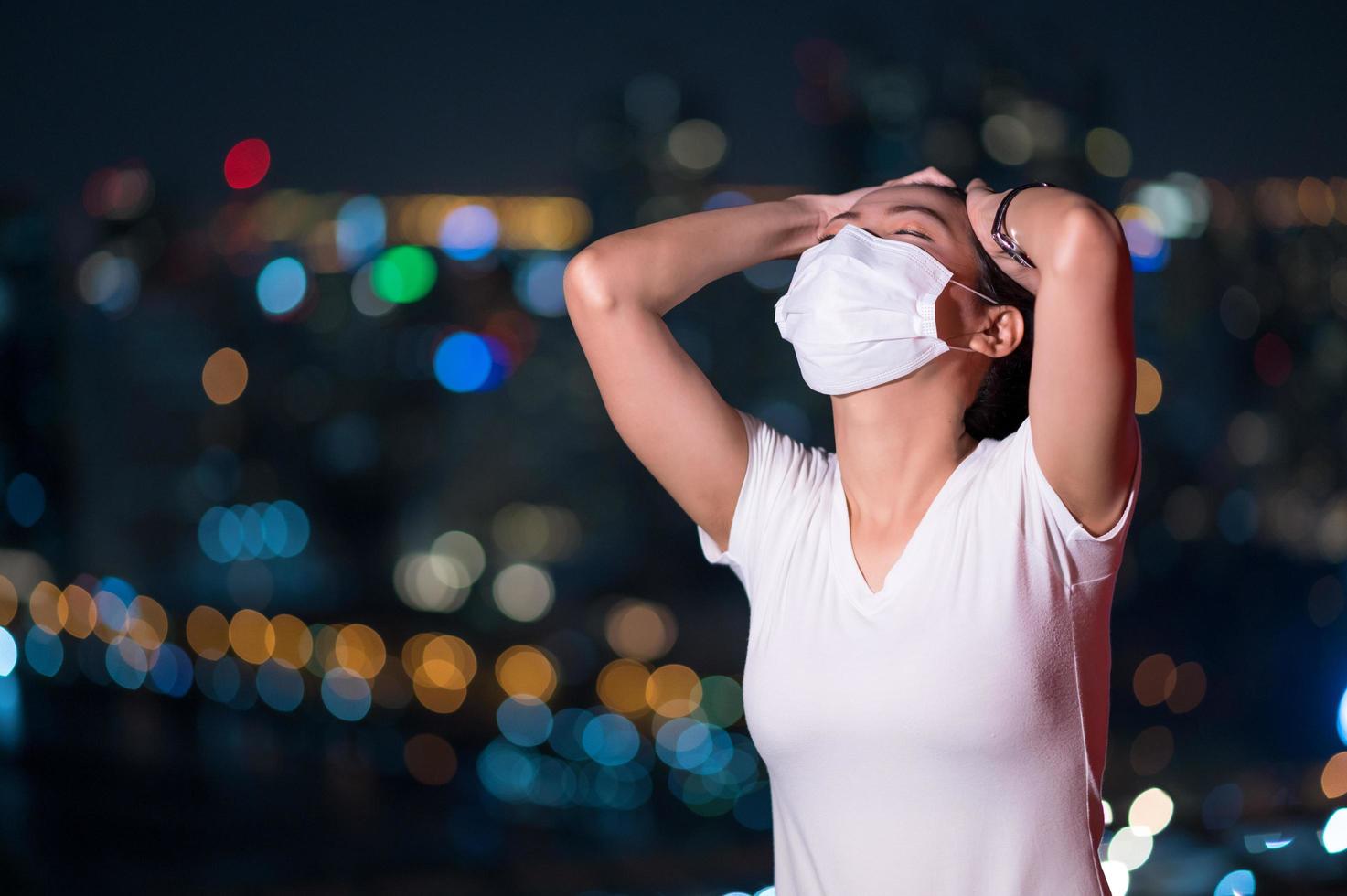 Asian women have to use a mask to cover the face to prevent pollution from dust photo