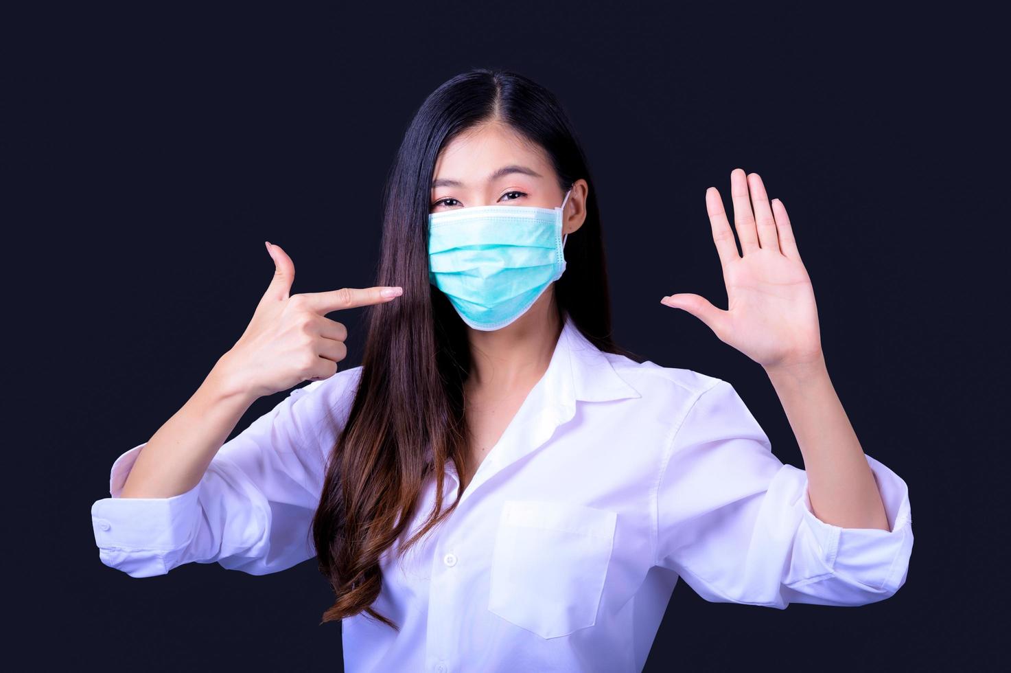 Asian women have to use a mask to cover the face to prevent pollution from dust photo