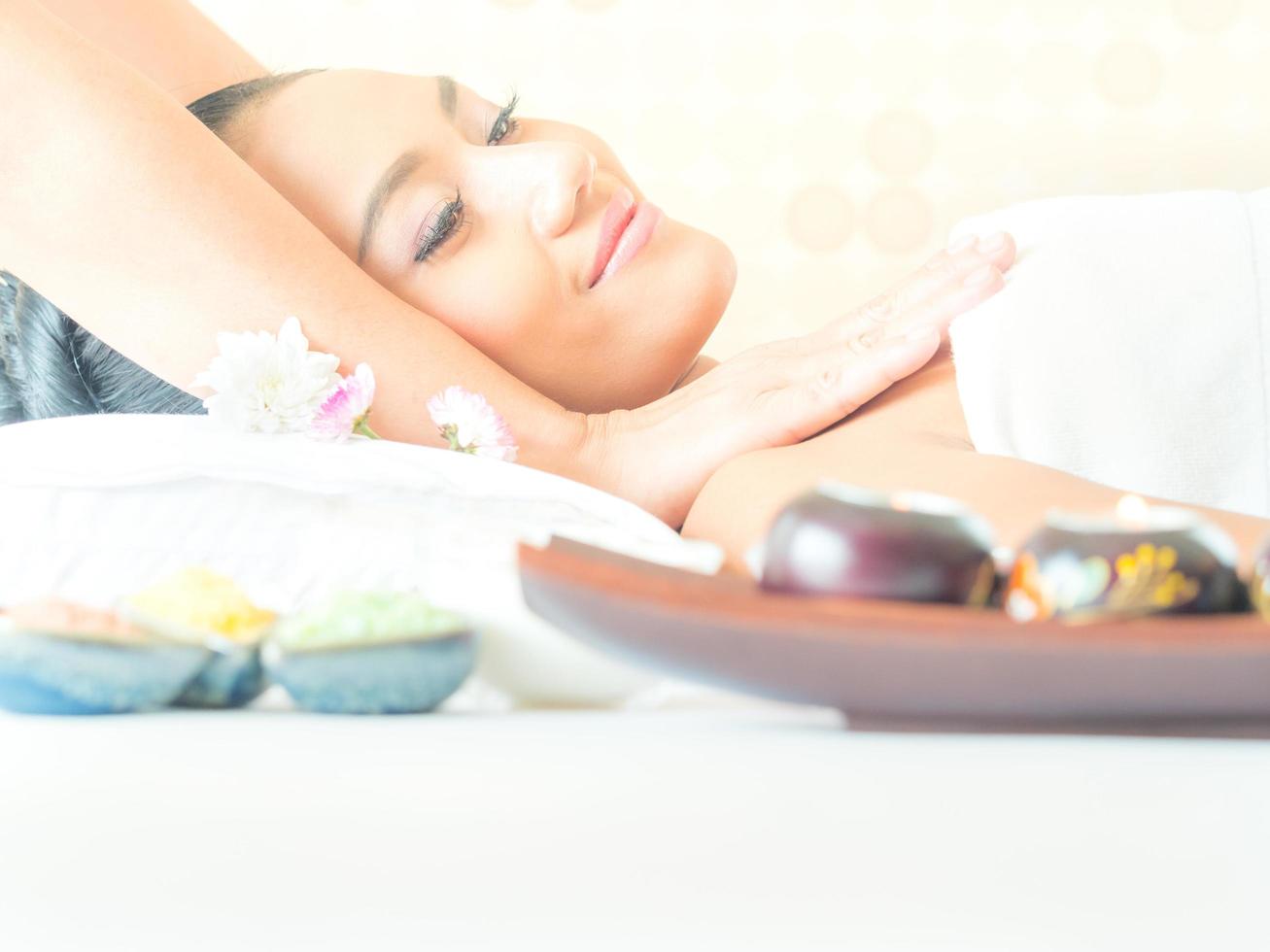 Young asian beautiful woman relaxing in spa salon photo