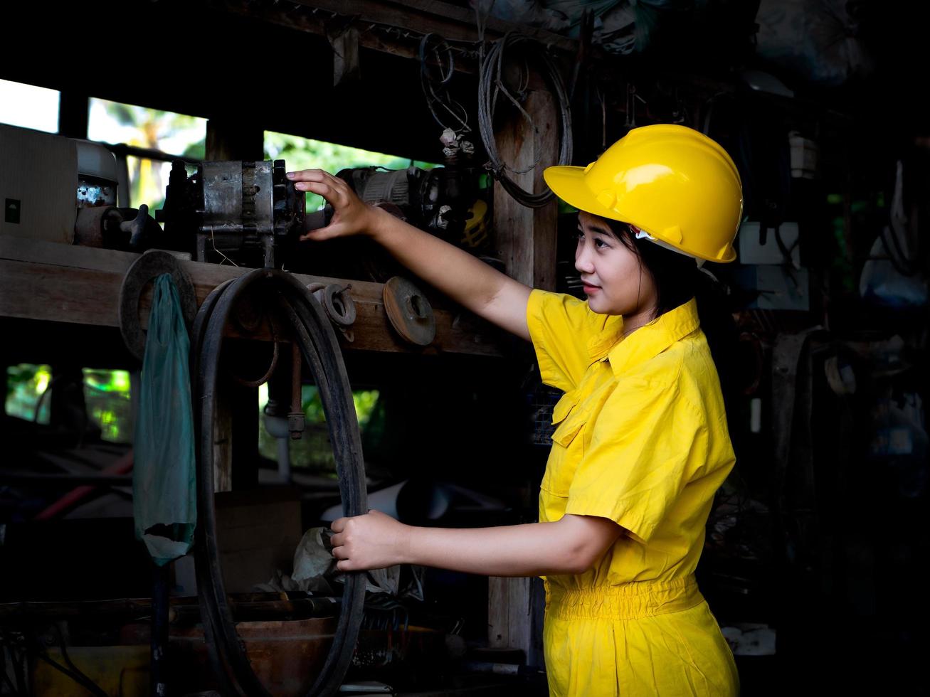 A woman in a uniform working in a technician is preparing to use the tools photo