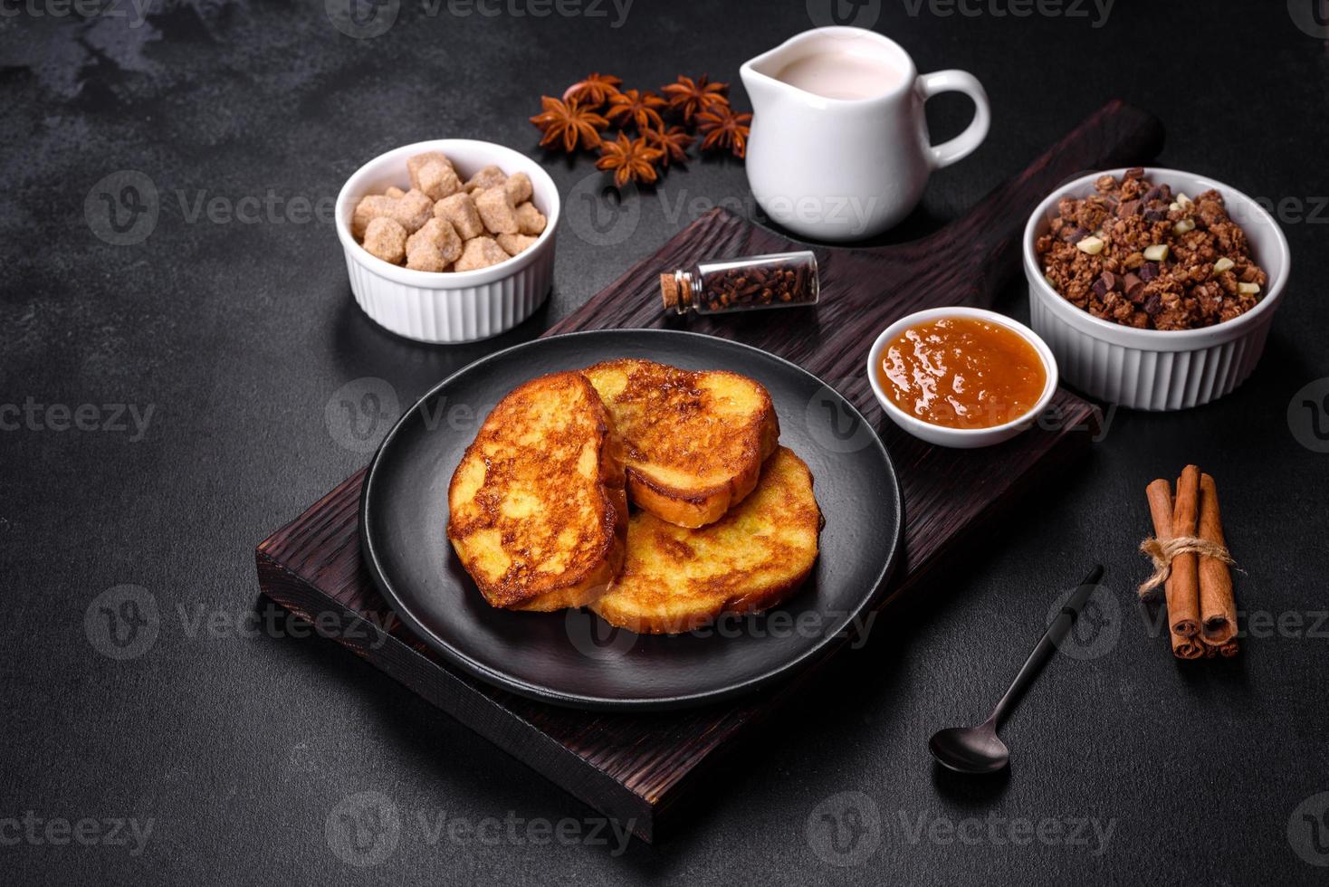 Cereal with chocolate, milk and bread in an egg against a dark concrete background photo