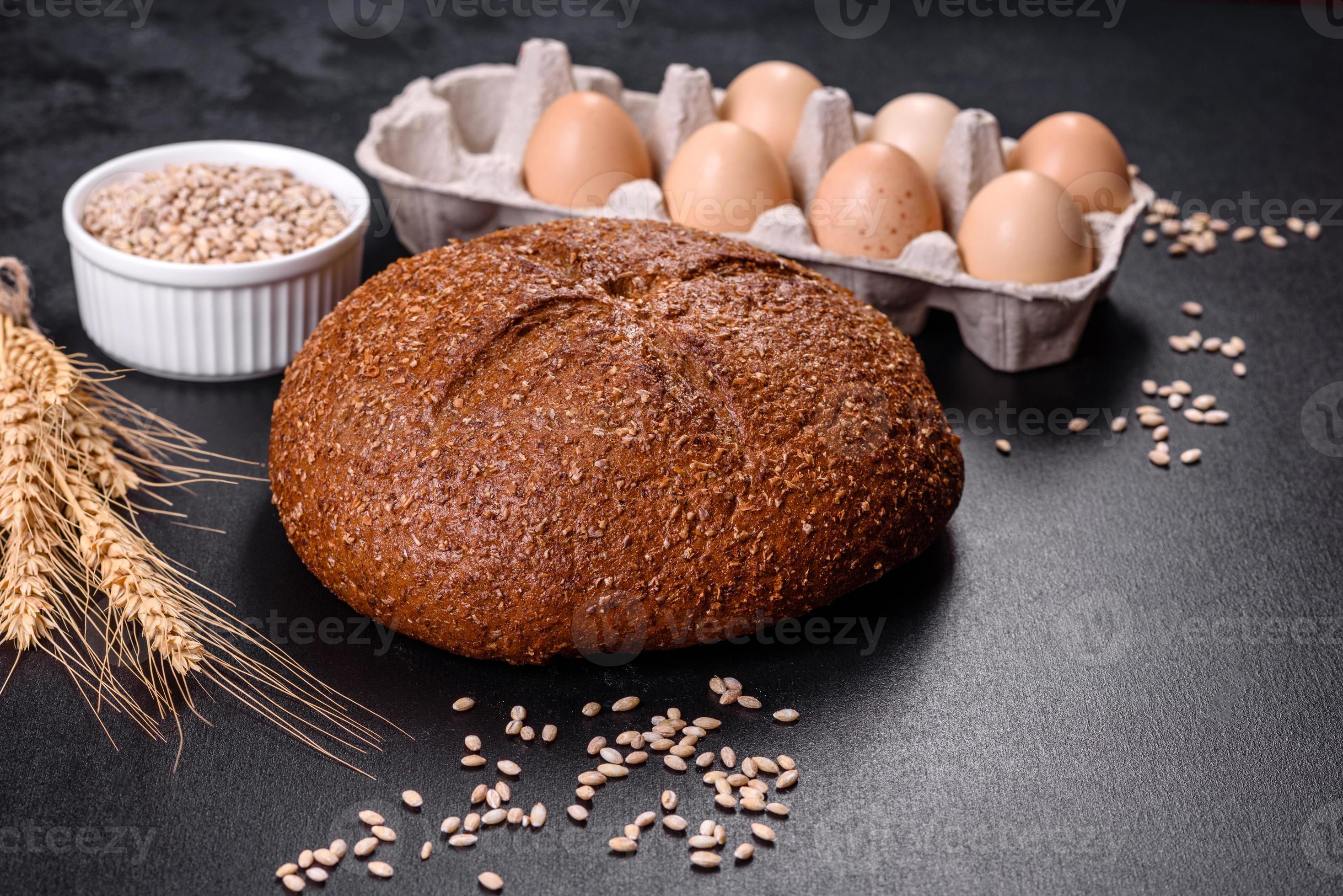 Fresh baked brown bread with ears and grains of wheat 7261022 Stock