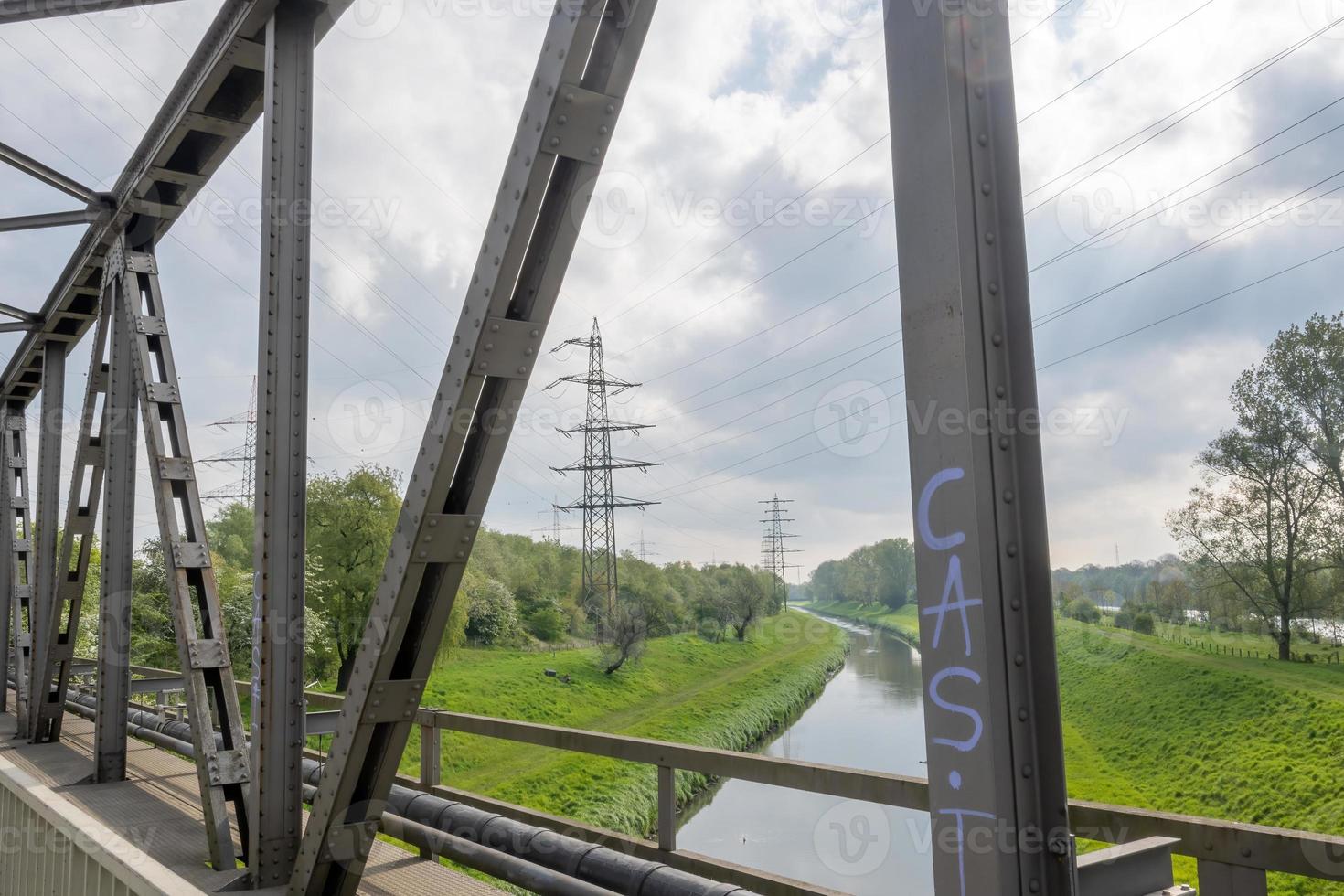 Bridge, canal, High voltage pylon for power supply photo