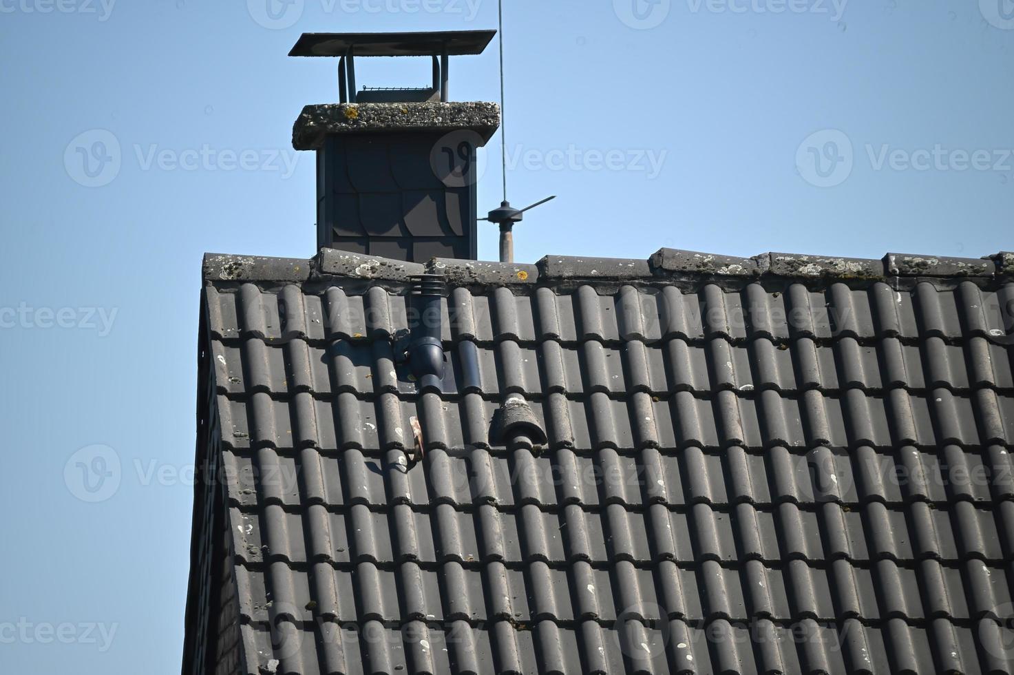 Rooftop of a house with a chimne photo