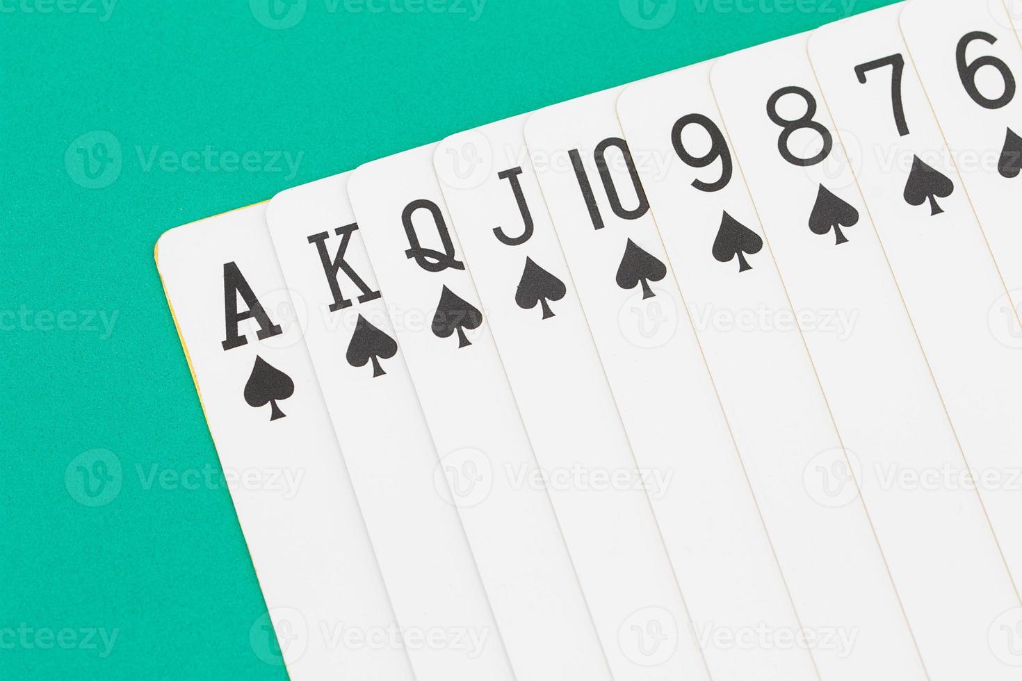 Cards on green casino table photo