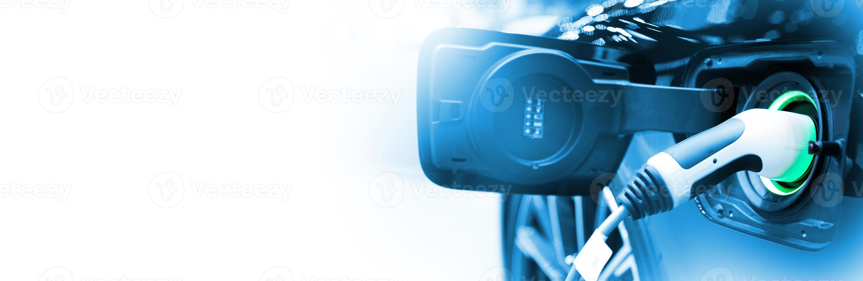 Charge EV car vehicle electric battery on station with blue car on panoramic banner white background with copy space. Idea for friendly environment nature electric energy technology green eco concept. photo