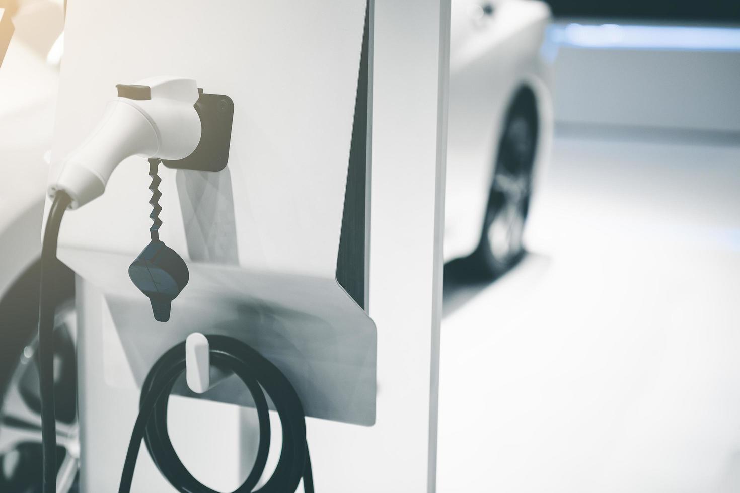 Electric EV car charging battery energy in station. photo