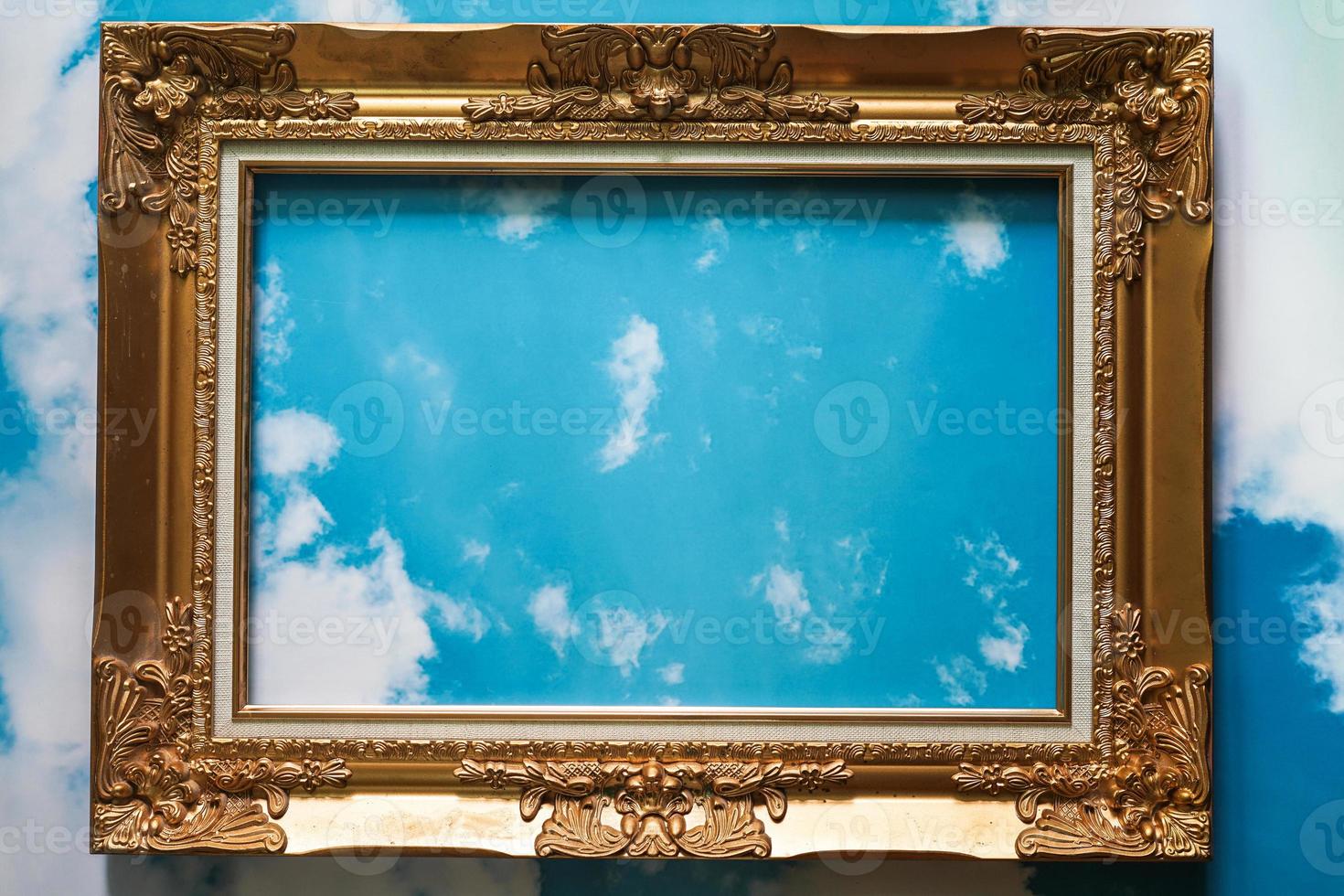 Golden frame. vintage frame isolated from sky background photo