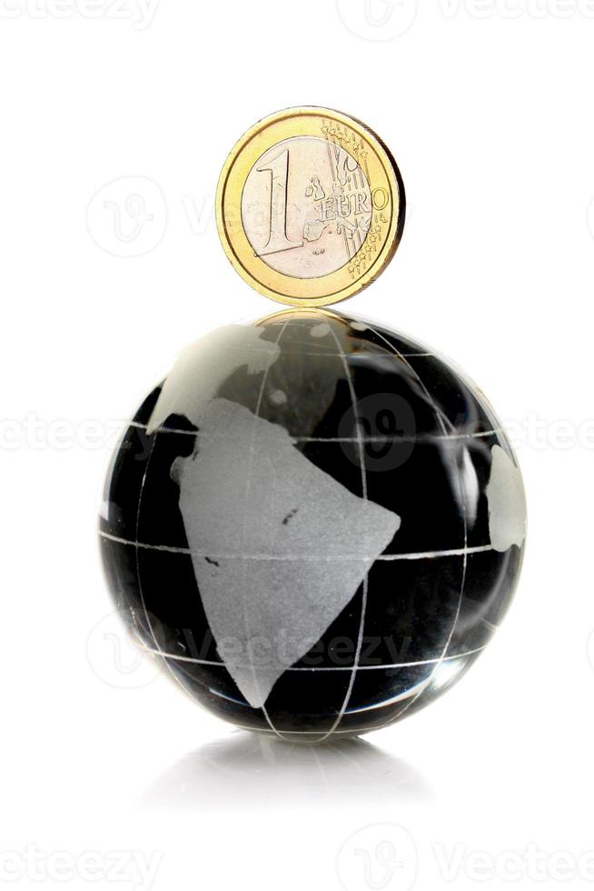 coin 1 euro on a glass globe photo