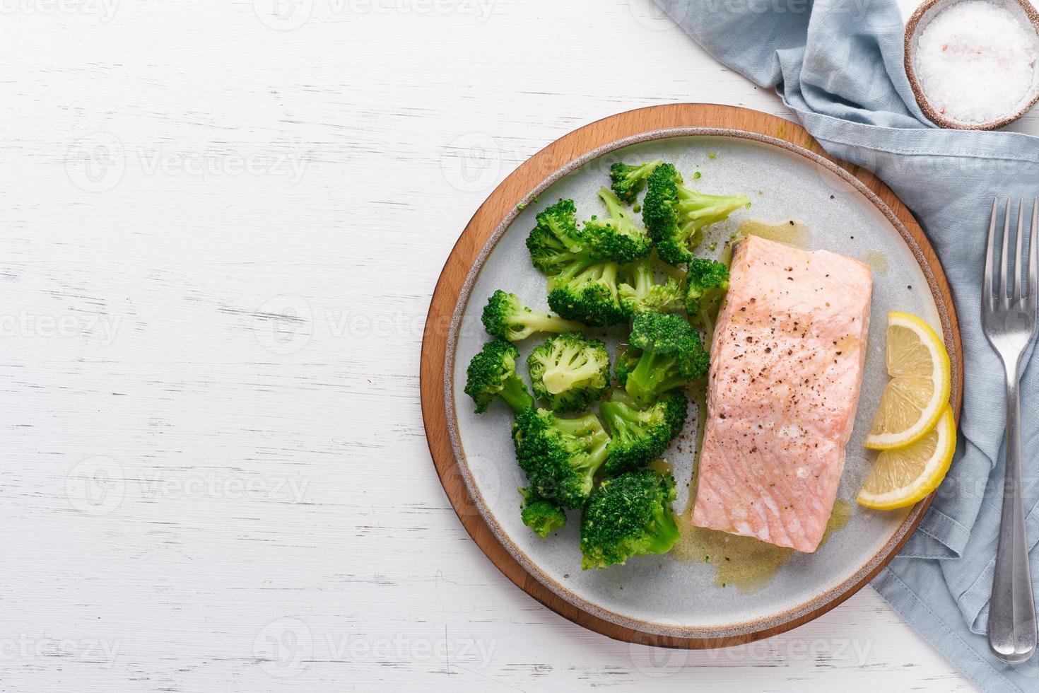 Steam salmon, broccoli, paleo, keto, lshf or dash diet. Mediterranean food. Clean eating, balanced photo