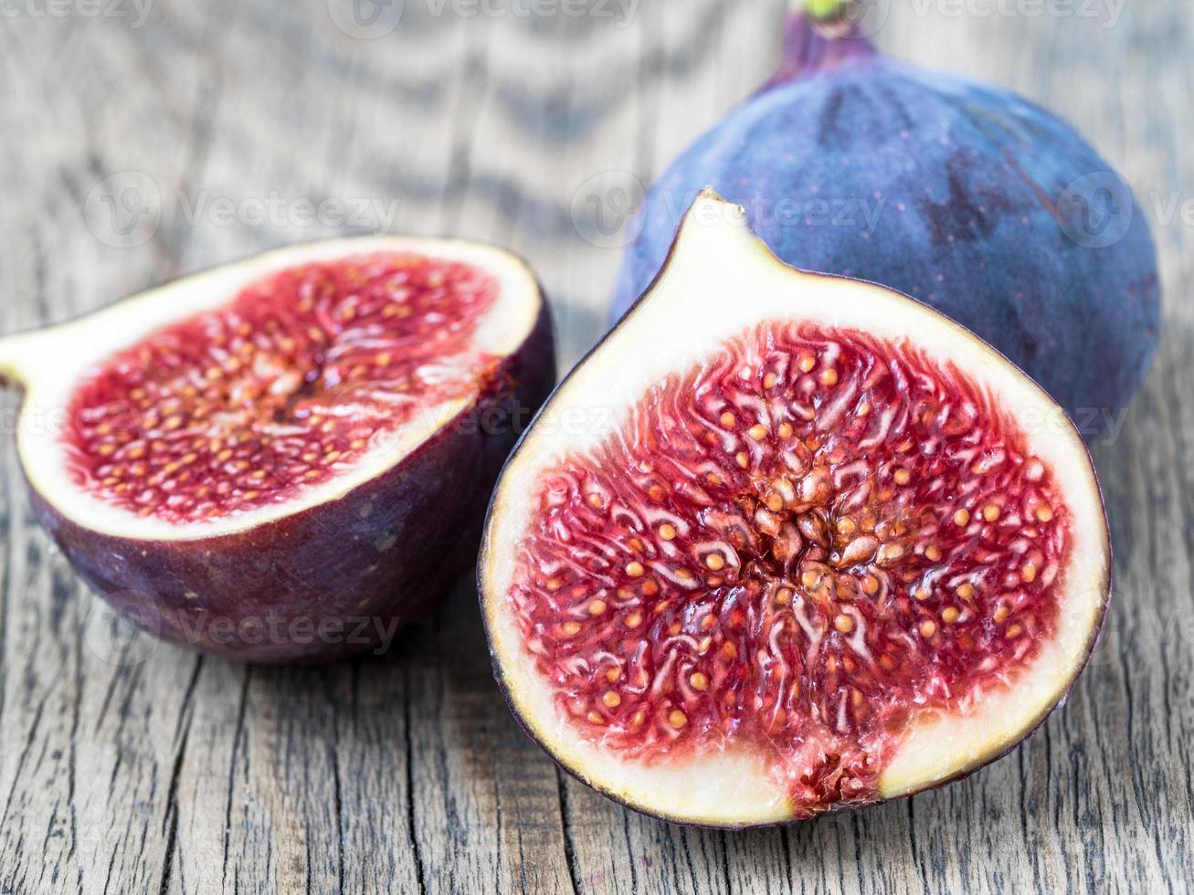 a fresh Fig and cut off half photo