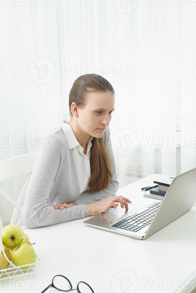 Distance education for students. Quarantine, self-isolation, sociophobia. Young girl listens photo