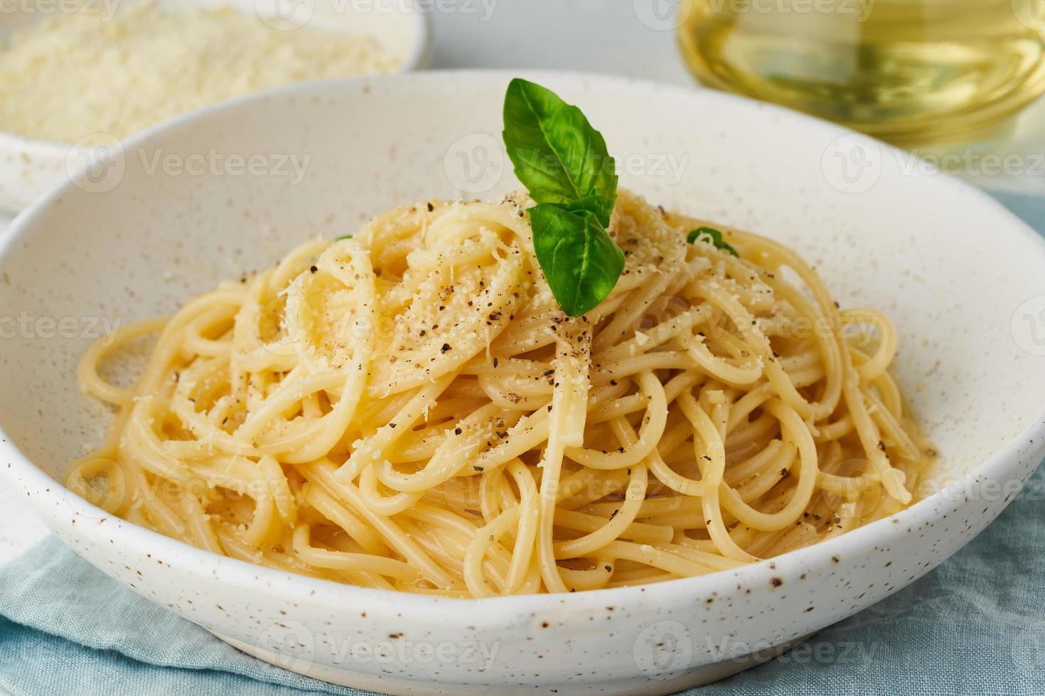 Cacio e pepe pasta. Spaghetti with parmesan cheese and pepper. photo