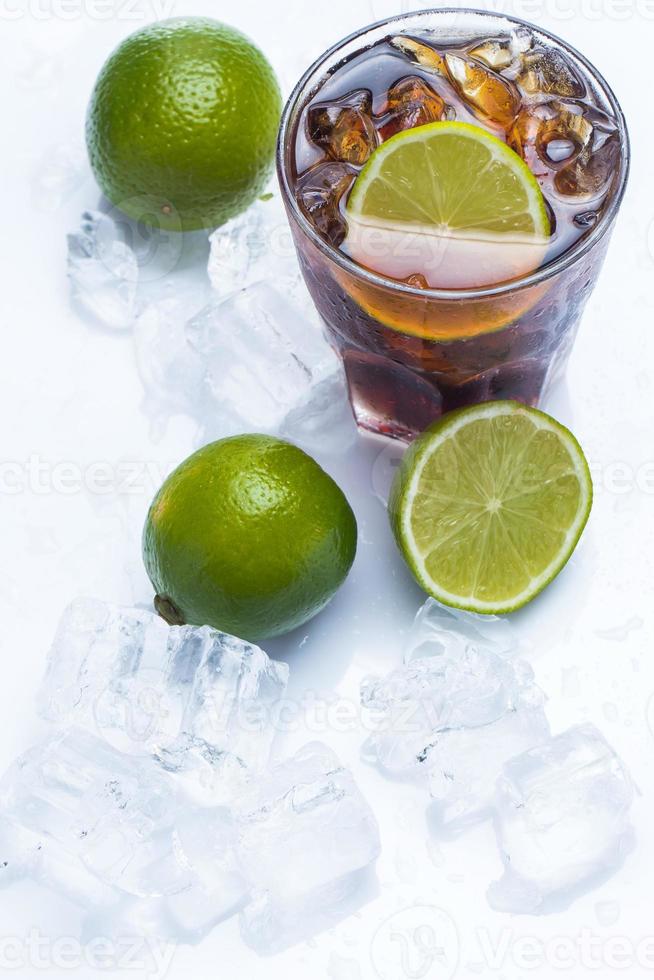 Fresh cocktail with cola drink and lime photo
