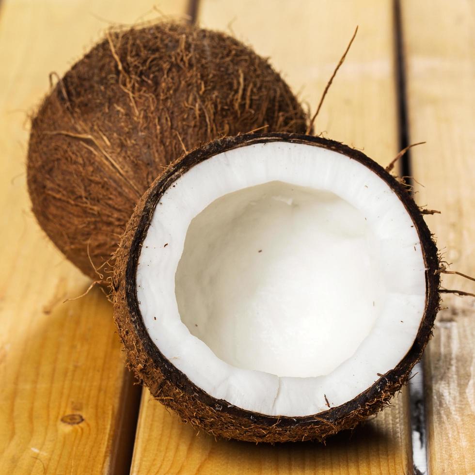 Fresh coconuts on wooden background photo