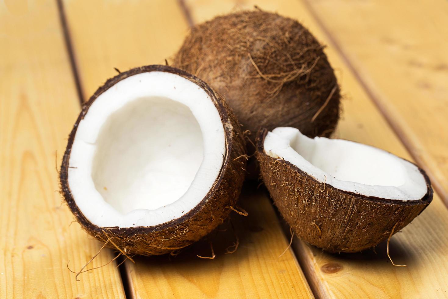 Fresh coconuts on wooden background photo