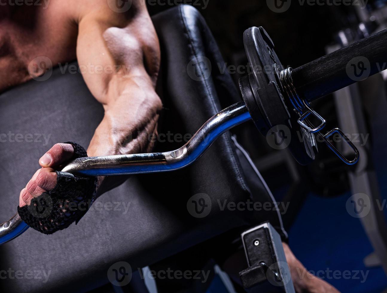 Biceps exercise in gym photo