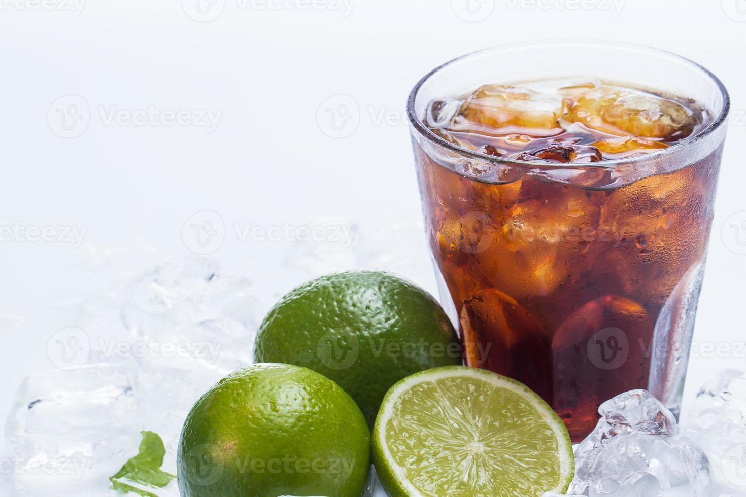 Fresh cocktail with cola drink and lime photo