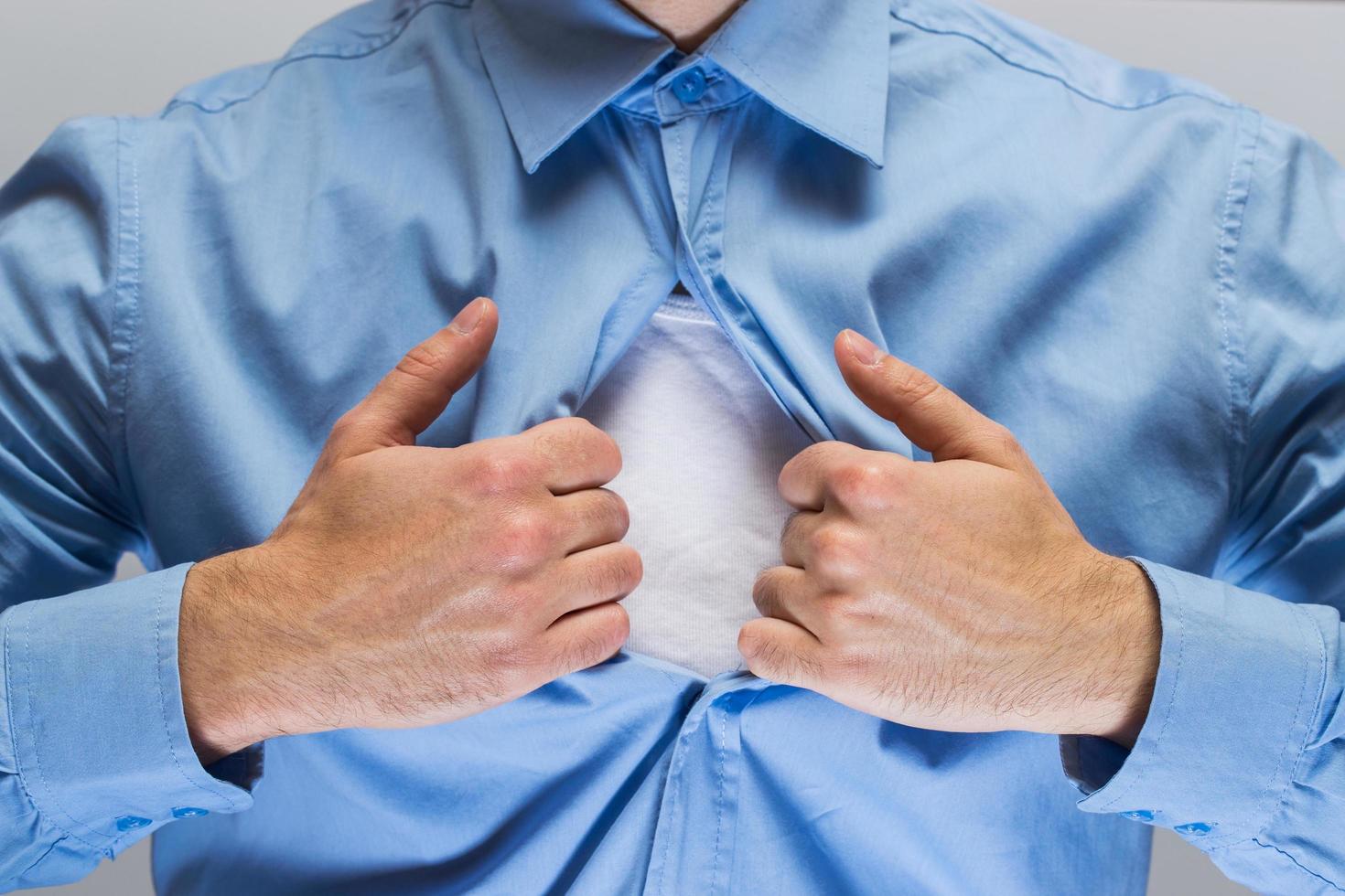 Man is opening his shirt photo