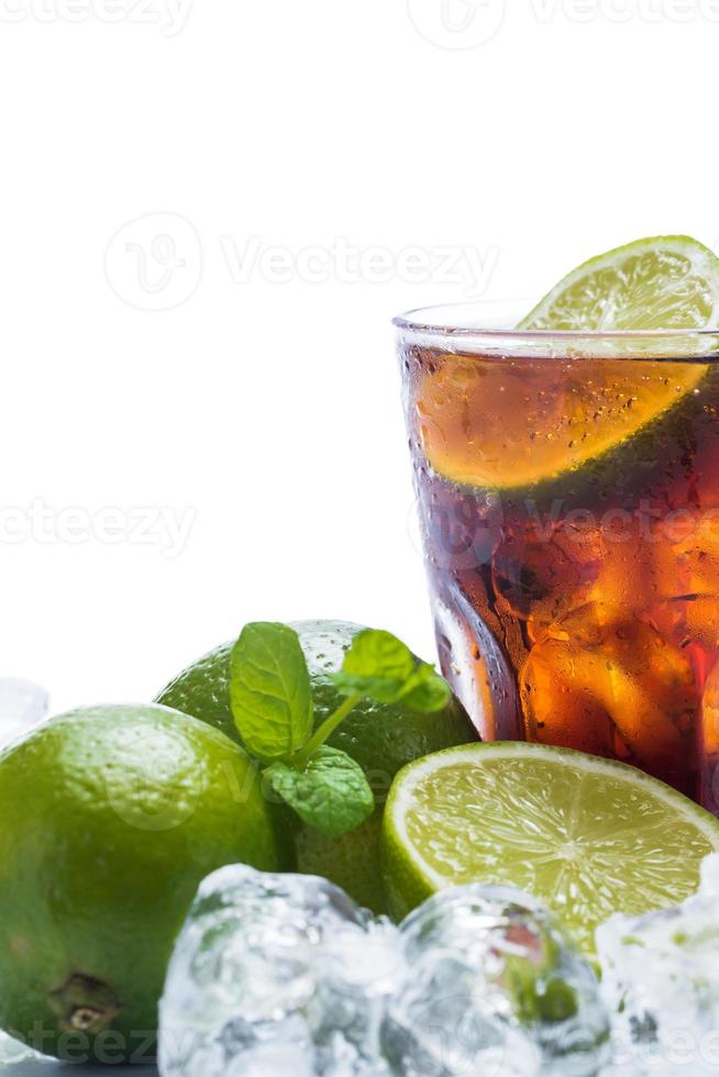 Fresh cocktail with cola drink and lime photo