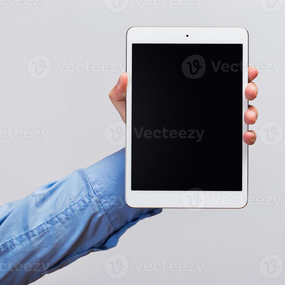 White tablet pc in hands photo
