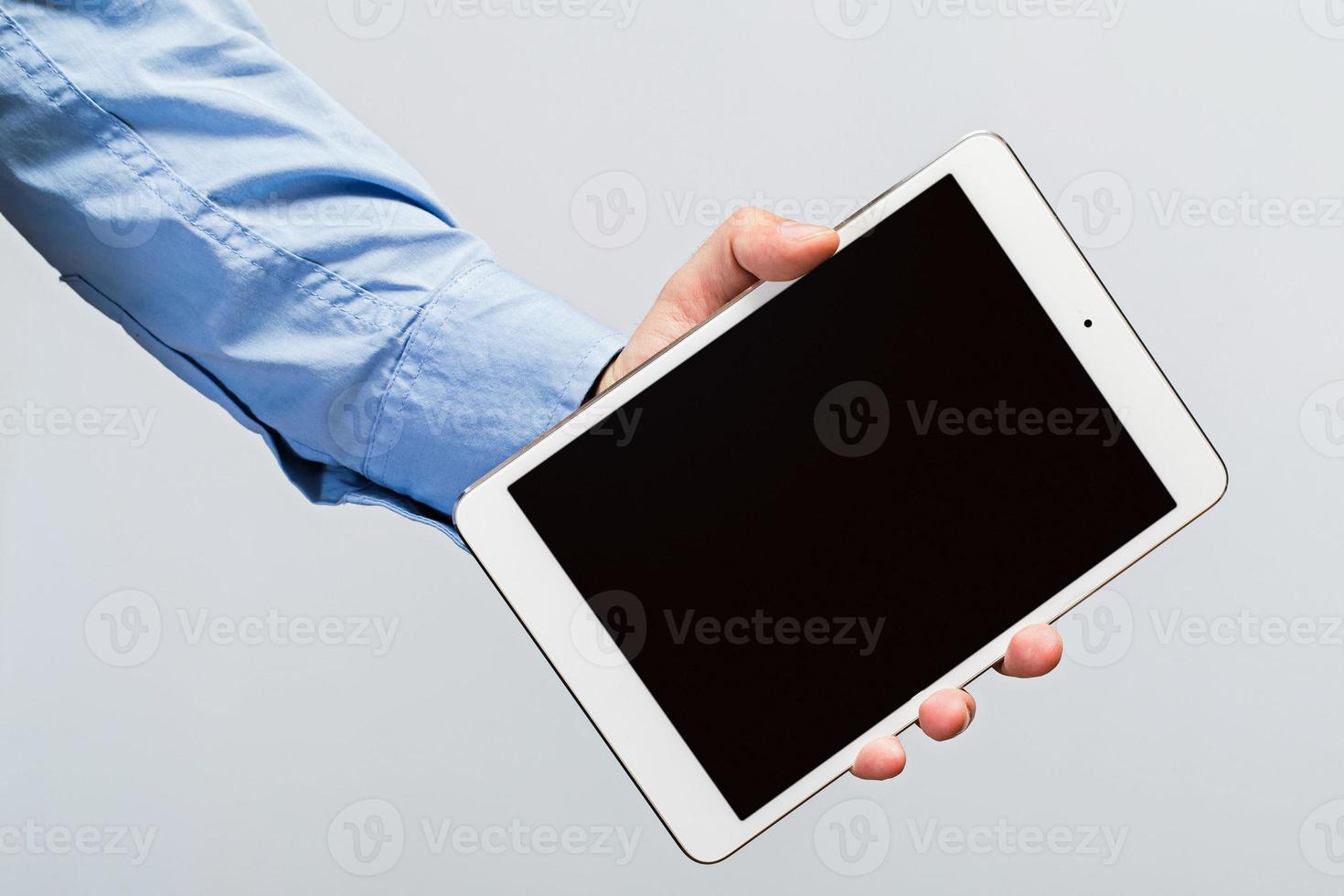 White tablet pc in hands photo