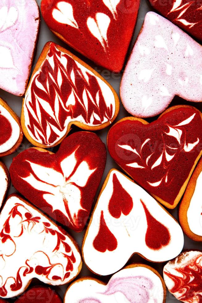 Valentine  day cookies. Heart shaped cookies for valentine day. Red and Pink Heart Shaped Cookies. Romantic seamless pattern with cookies hearts. photo