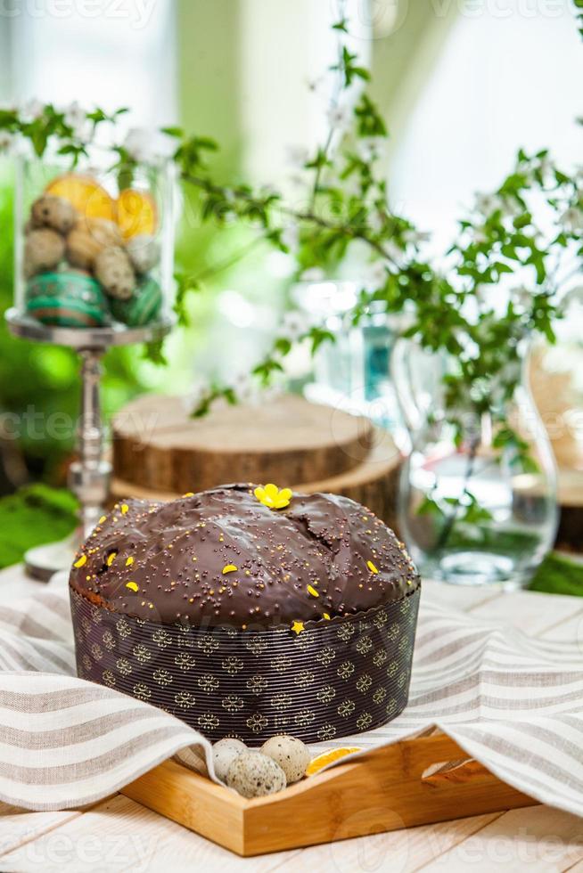 Home Made Panettone. Traditional Italian sweet bread. Panettone with a slice served on a wooden table. photo