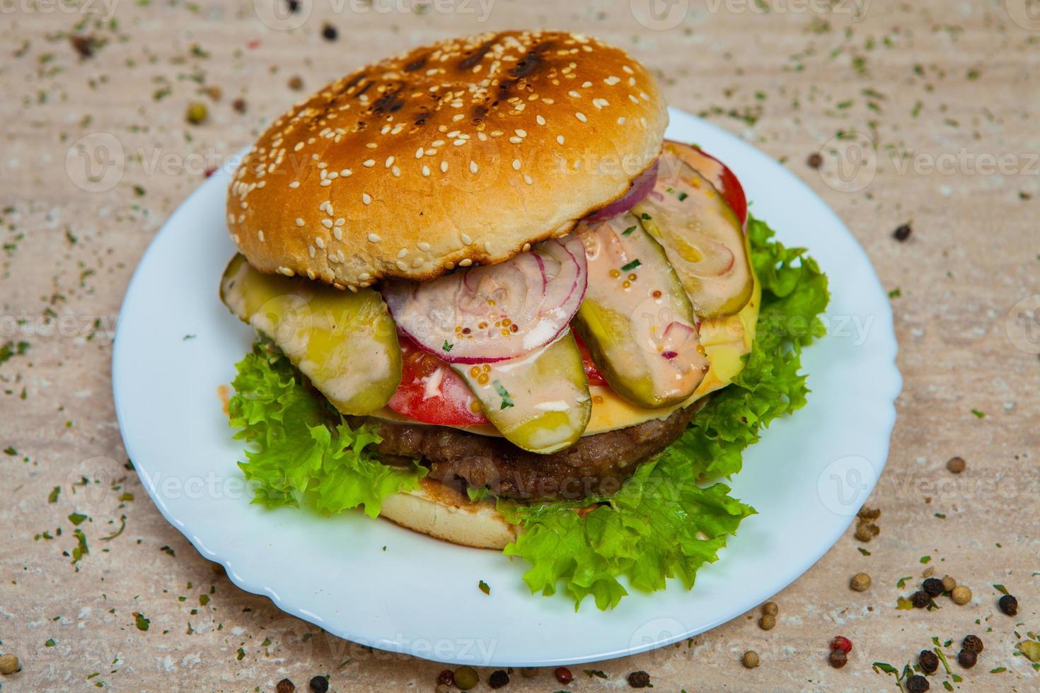 Top view hamburger on the wooden background . Hamburger, homemade hamburger with fresh vegetables.Beef burger. photo