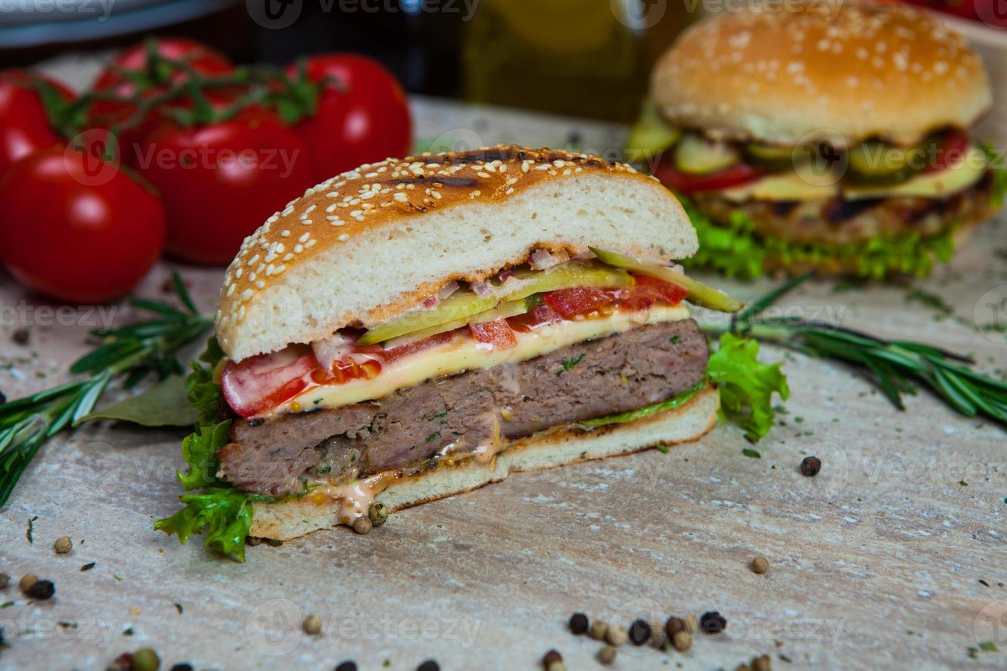 Top view hamburger on the wooden background . Hamburger, homemade hamburger with fresh vegetables.Beef burger. photo