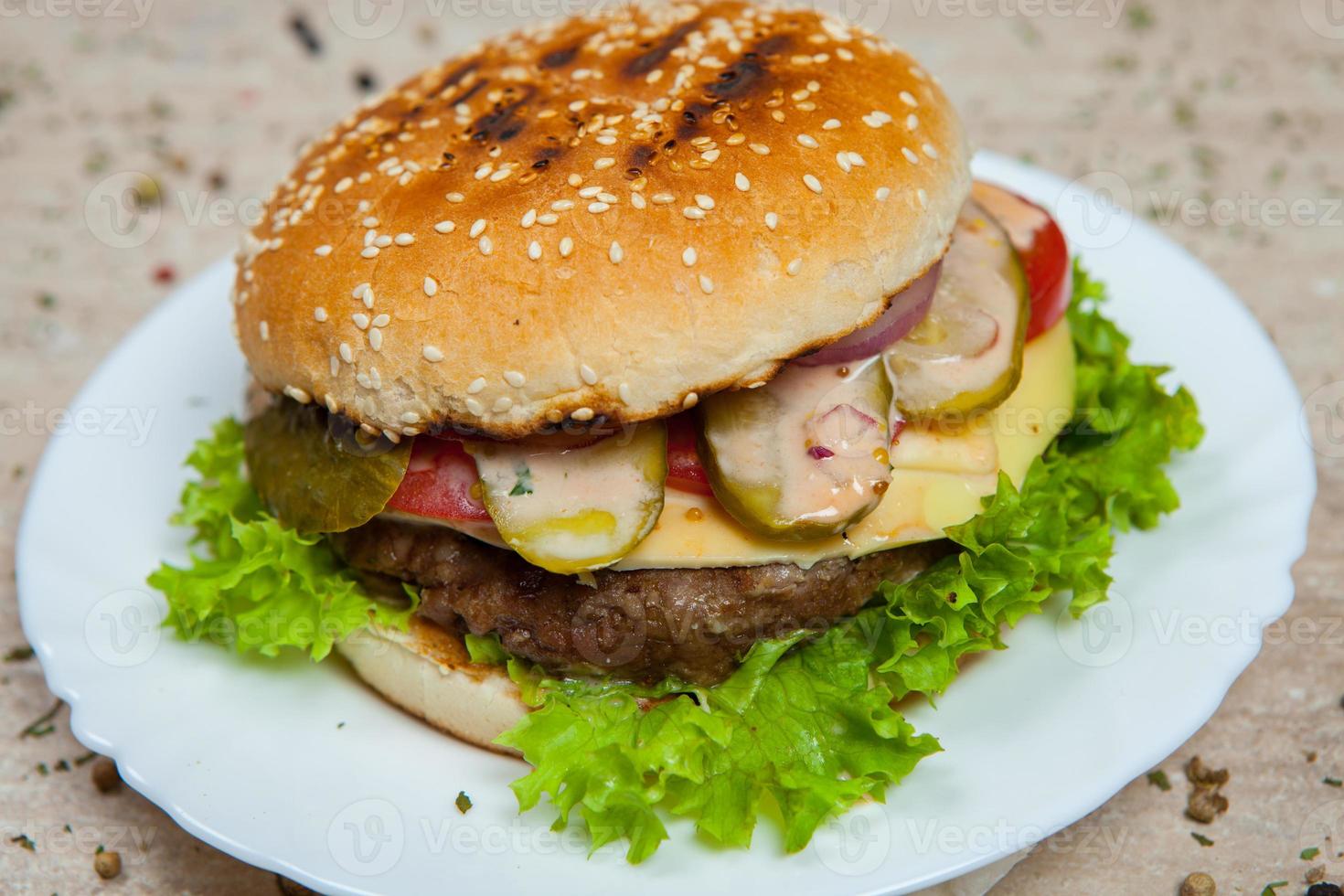 Top view hamburger on the wooden background . Hamburger, homemade hamburger with fresh vegetables.Beef burger. photo