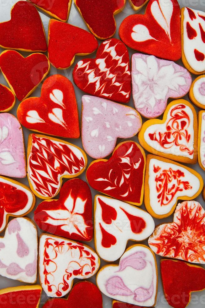 Valentine  day cookies. Heart shaped cookies for valentine day. Red and Pink Heart Shaped Cookies. Romantic seamless pattern with cookies hearts. photo