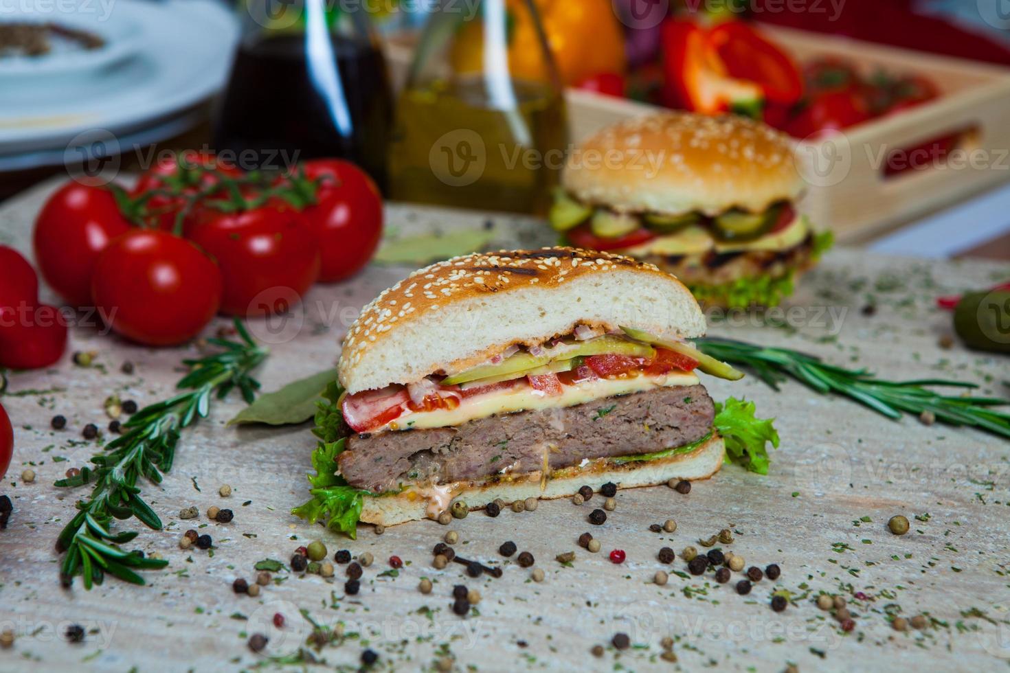 Top view hamburger on the wooden background . Hamburger, homemade hamburger with fresh vegetables.Beef burger. photo