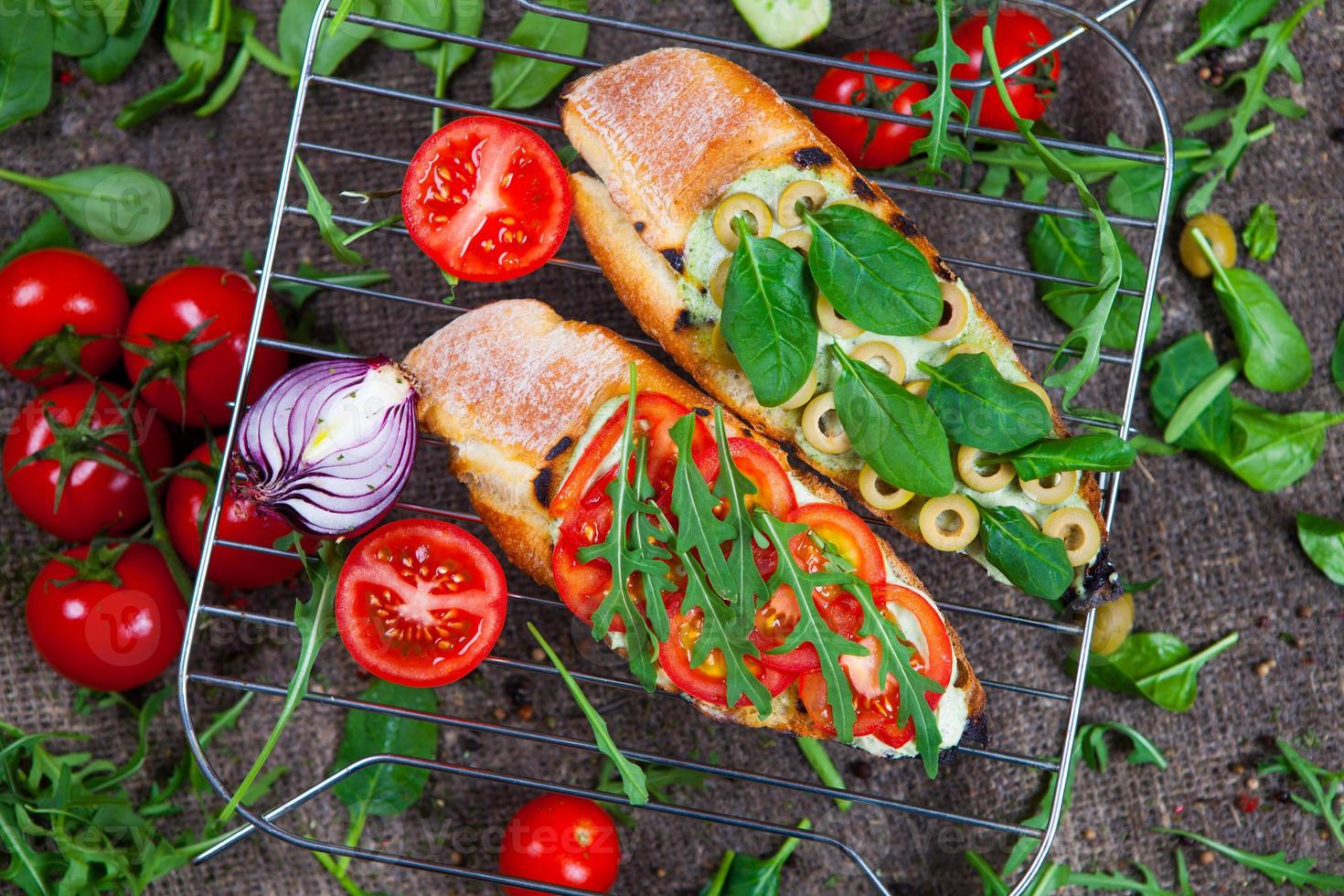 Appetizing bruschetta. Traditional Italian bruschetta. Open sandwich with salmon and vegetables. Delicious healthy food. European cuisine. photo