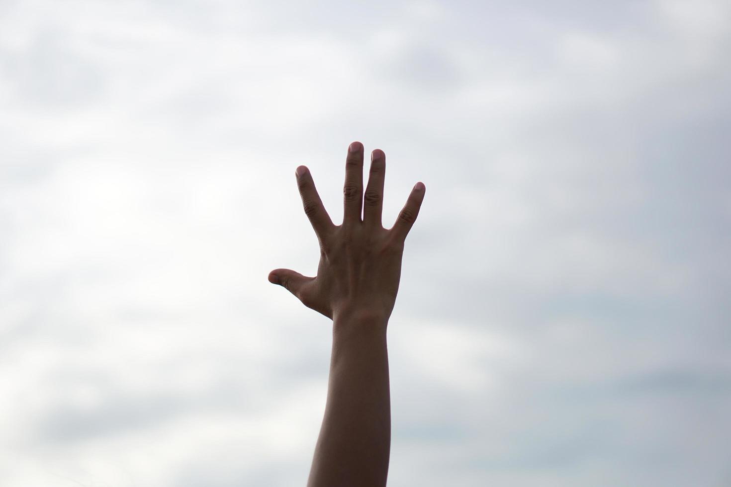 Human hands open palm up worship background photo