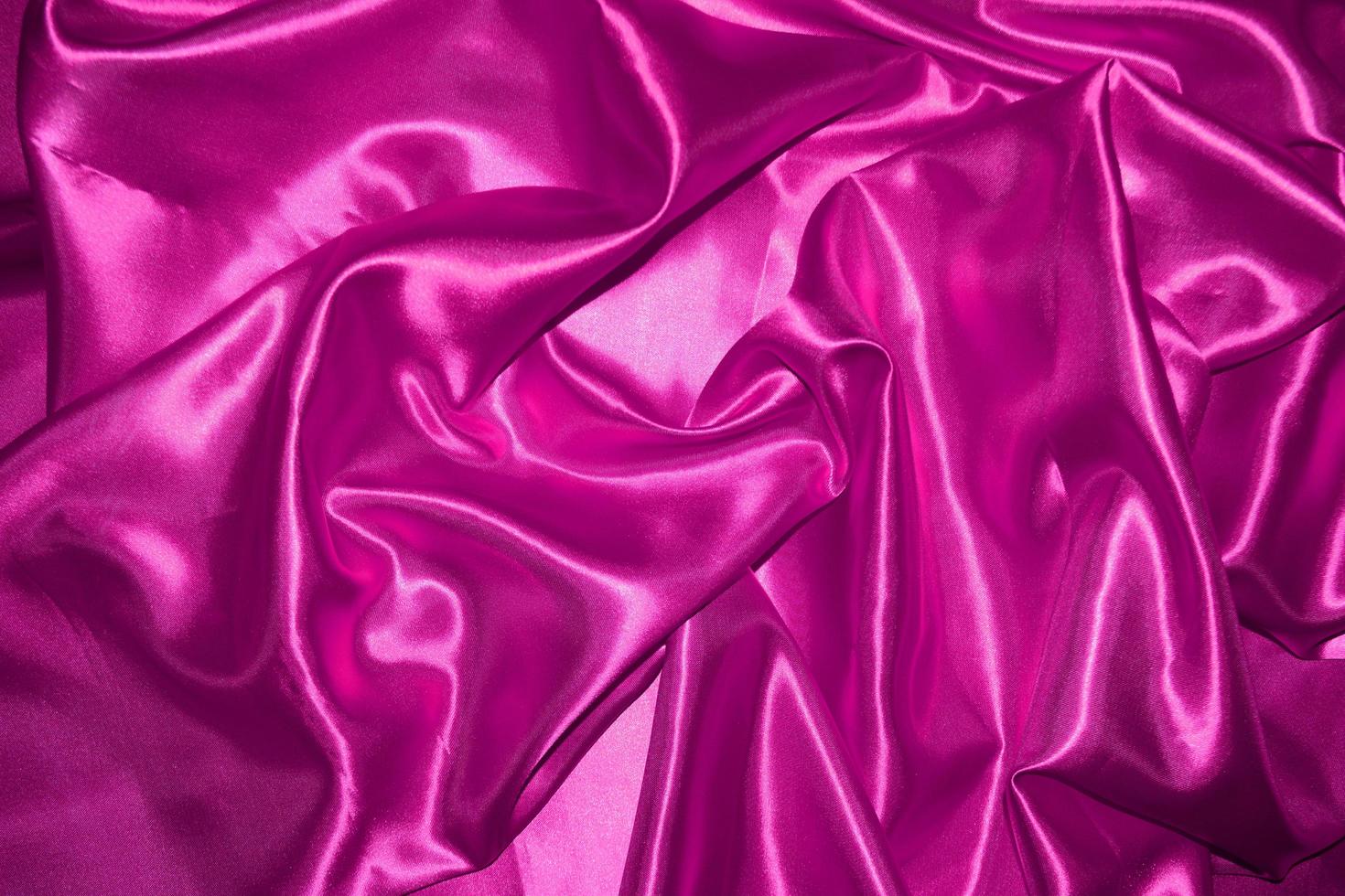 abstract purple fabric background with soft waves photo