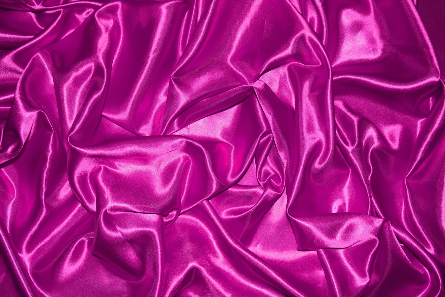 abstract purple fabric background with soft waves photo